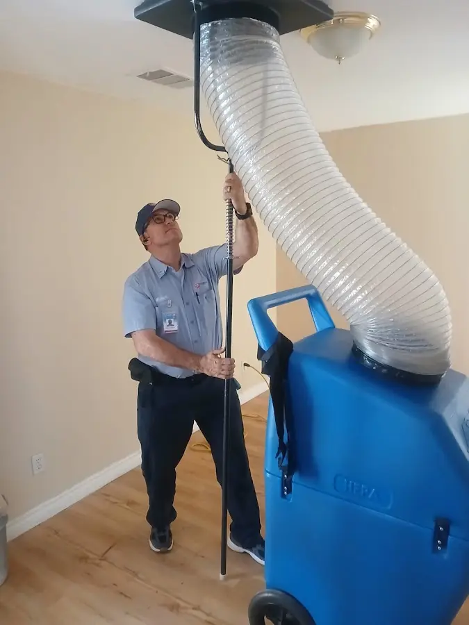 Furnace Tune-Up technician using HEPA equipment in Meridianville